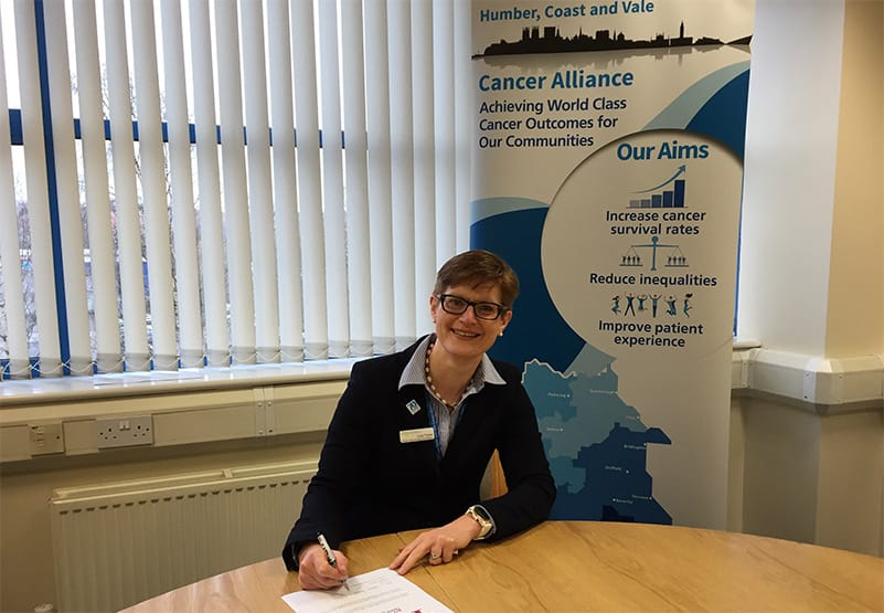 Humber, Coast and Vale's former Programme Director, Lucy Turner, signing a pledge to increase cervical screening.