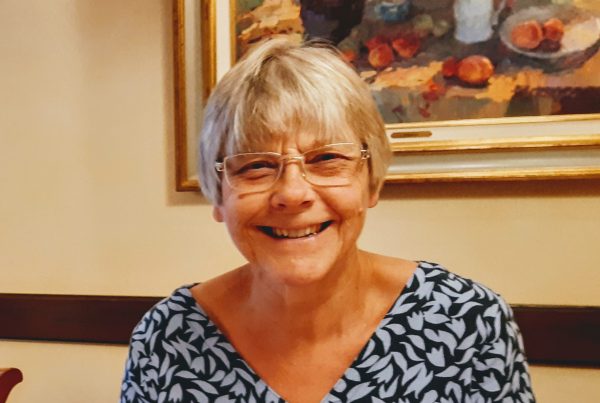 Carolynne, leader of the Myeloma North Lincs support group. She has short white hair, is wearing glasses and smiling at the camera.