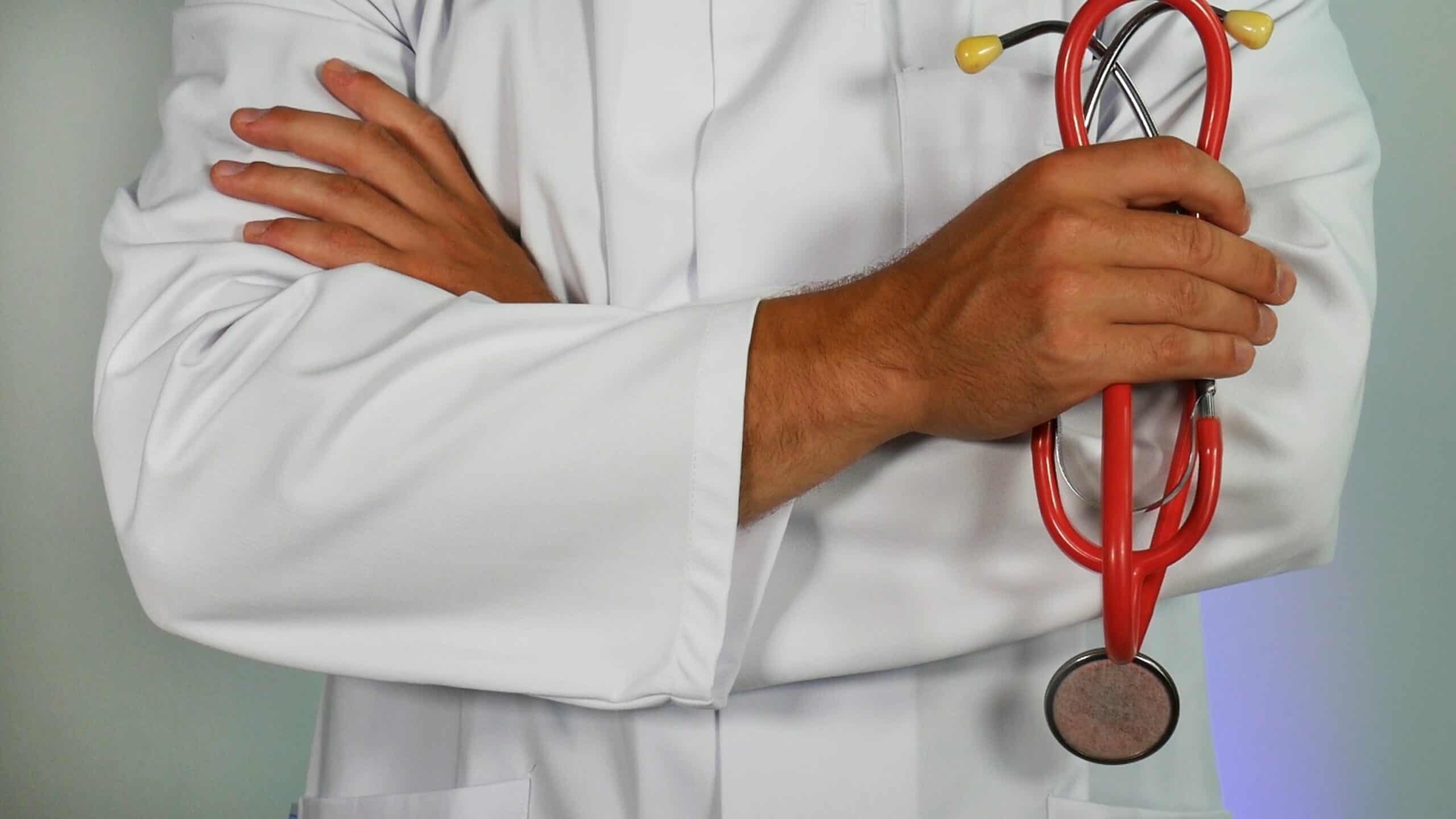 picture of a doctor in a white coat holding a stethoscope