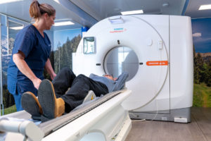 Nurse putting patient into CT scanner for Lung Health Check