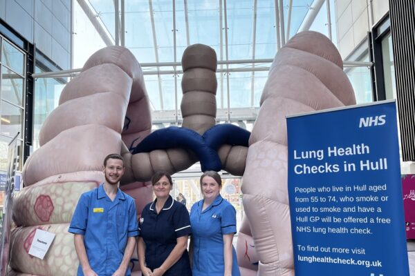 Lung health check nurses in front of the 12ft inflatable lungs